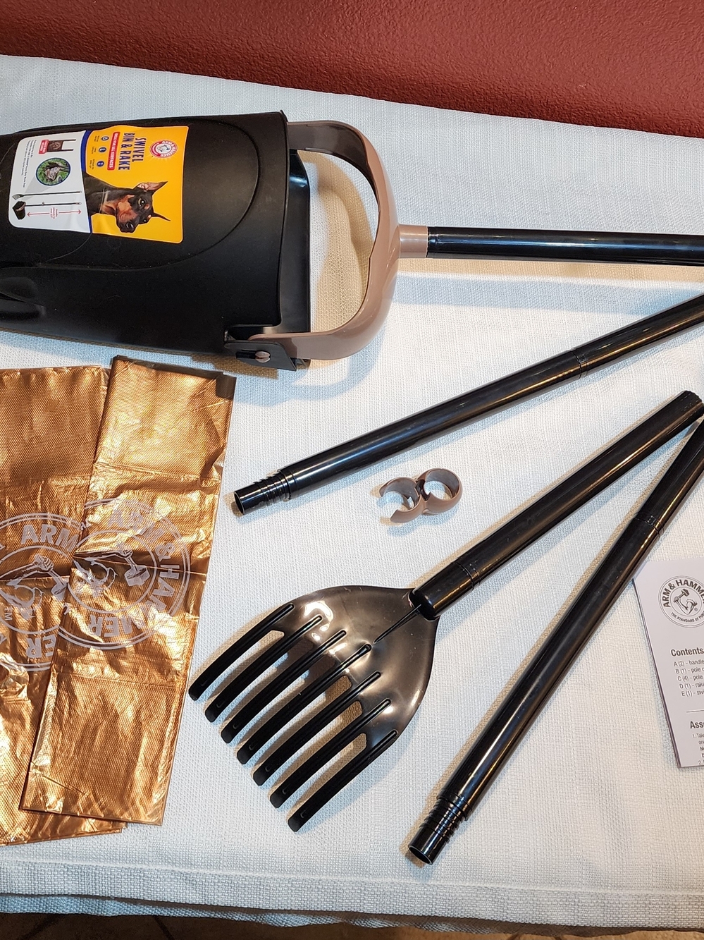 Two Arm & Hammer Black and Tan Pet Waste Scoopers.